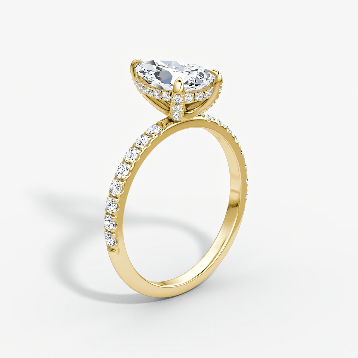 The Classic Hidden Halo Pear Engagement Ring in Pave Standard Band