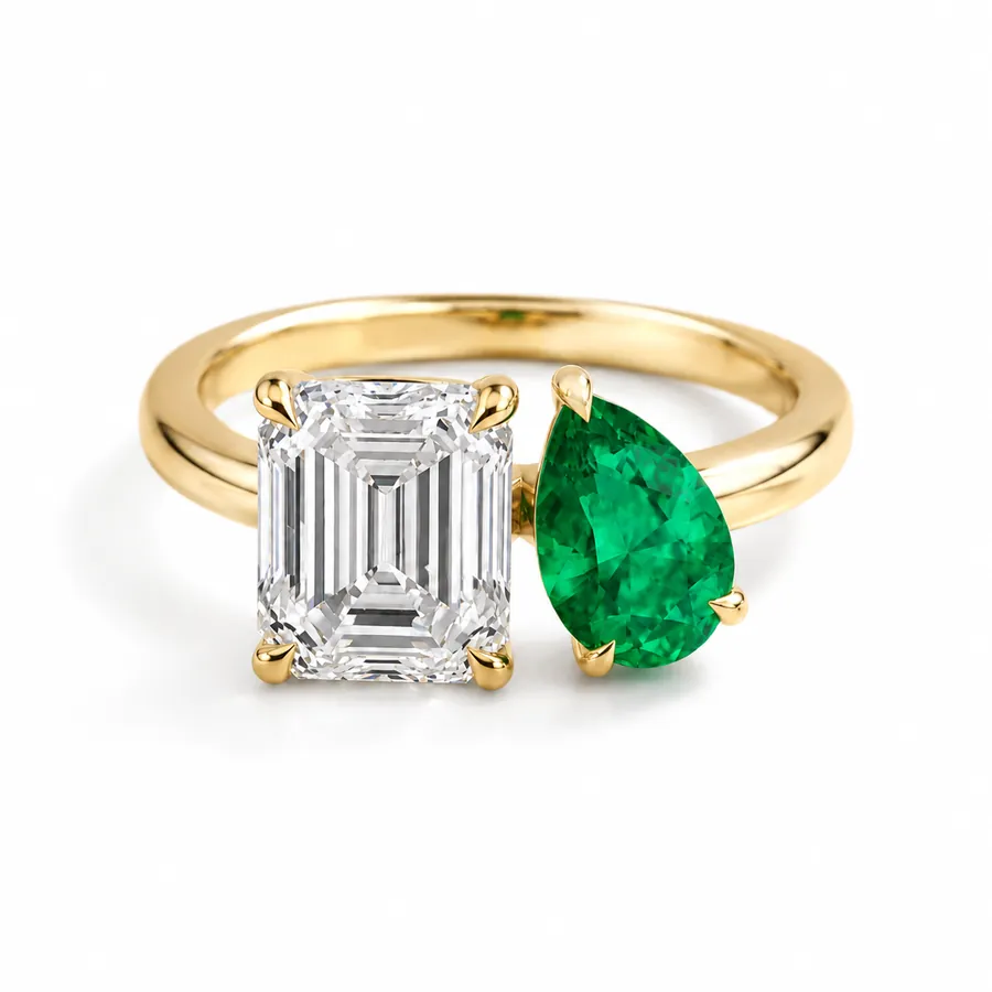 The Emelia — Emerald and pear emerald engagement ring in yellow gold